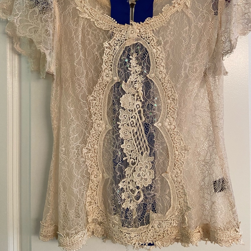 Lace blouse with exposed zipper
